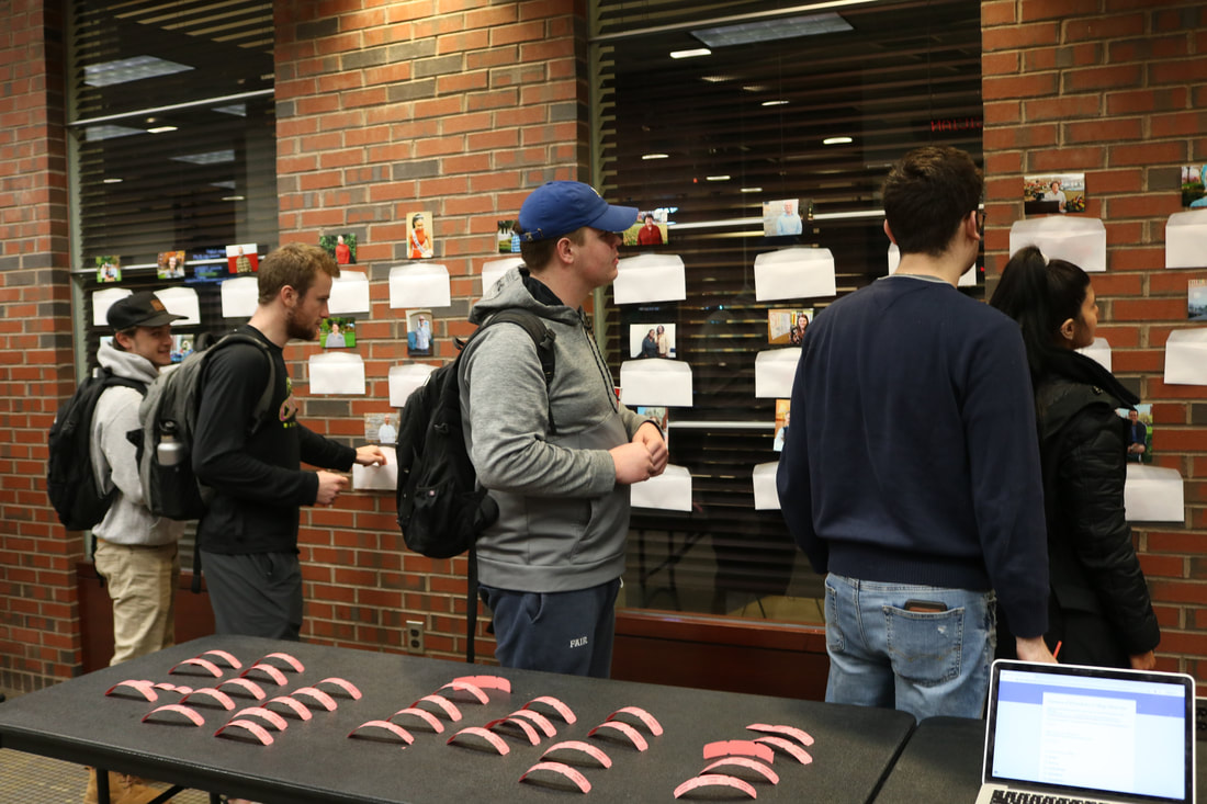 PC students voting in-person for the showcase